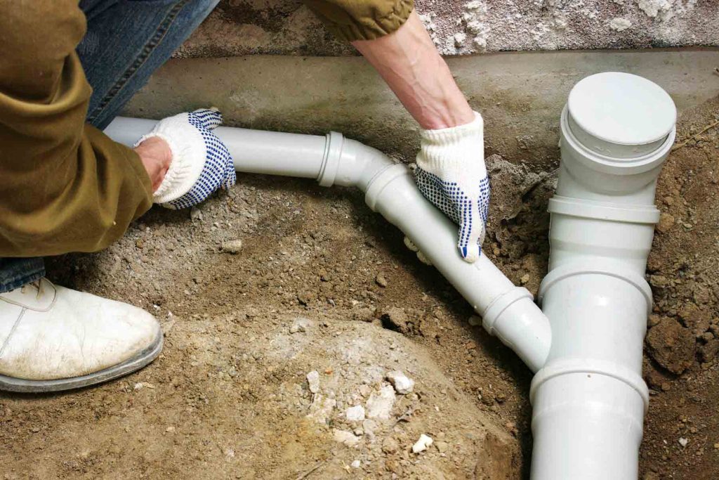 Sewer line repair cost project with hands-on PVC pipe installation